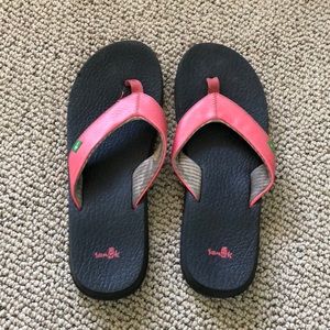 Pink Sanuk foam flip flops